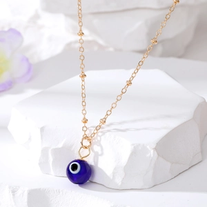 Vintage gold-plated evil eye pendant necklace with delicate round beads for women