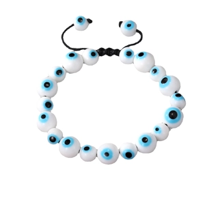Adjustable evil eye charm bracelet with white ceramic beads and black braided cord