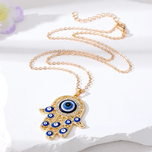Collier Main de Fatma vintage avec pendentif œil bleu et strass brillants
