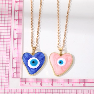 Blue and pink heart pendants with marble resin effect and evil eye on gold chain