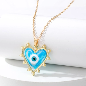 Collier cœur doré avec pendentif mauvais œil bleu marbré et bordure en perles