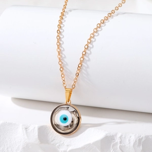 Detailed macro view of Evil Eye pendant necklace with marble texture on white display stand