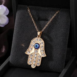 Bohemian gold Hamsa Hand necklace with evil eye heart pendant and rhinestones