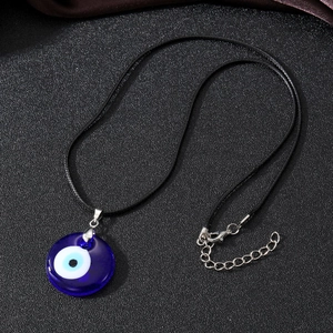 Vintage evil eye pendant necklace with blue glass and adjustable black cord strap
