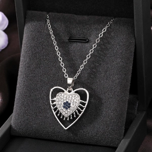 Bohemian silver heart necklace with blue floral center and white rhinestones in a gift box