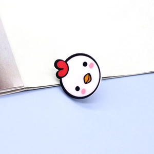 Close-up of a cute yellow chick cartoon shoe charm accessory for clog decoration