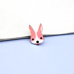 Macro detail of cartoon animal pin featuring a playful pink bunny badge with enamel finish