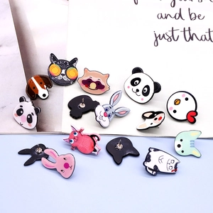 Detailed view of colorful acrylic cartoon animal brooches with secure metal pin backings