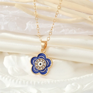 Collar vintage de oro con colgante de flor azul, ojo turco y cristales brillantes