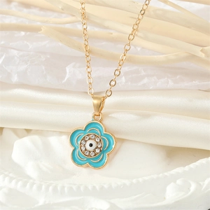 Collar dorado vintage con colgante de flor de ojo azul y brillantes piedras de circonita