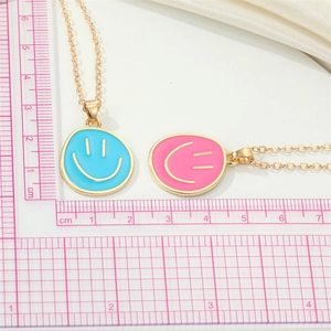 Colorful smiley face pendant necklaces in sky blue and pink with golden alloy chains
