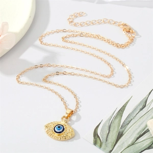 Boho gouden ovale boze oog hanger ketting met antieke getextureerde details