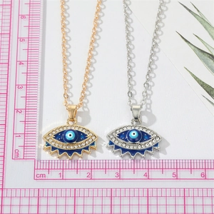 Vintage Turkish evil eye pendant necklace with blue crystals in gold and silver finish