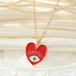 Collier cœur vintage avec émail rouge et œil maléfique pour femme en métal doré