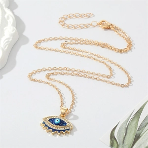 Retro Evil Eye pendant necklace with blue crystal inlay and gold chain for women