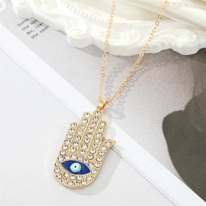 Collier Main de Fatma vintage doré avec Oeil Bleu et cristaux scintillants