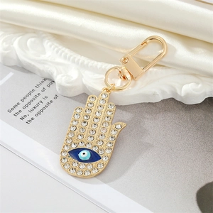 Porte-clés main de Fatima vintage doré avec strass et pendentif œil bleu protecteur