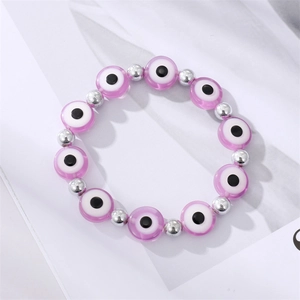 Vintage evil eye bead bracelet with purple resin charms and silver spherical beads