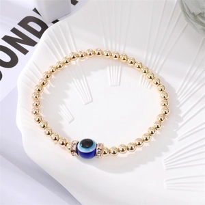 Handmade gold beaded evil eye bracelet with sparkling crystal rhinestones and blue bead