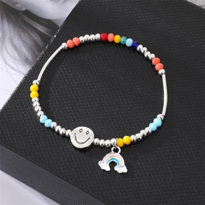 Colorful beaded bracelet with rainbow beads, smiley face charm and rainbow cloud pendant