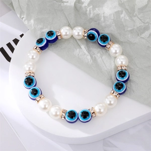 Bracelet fait main avec perles en verre œil bleu et perles blanches pour femmes