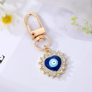 Detail of evil eye heart keychain with gold plating and sparkling crystal accents