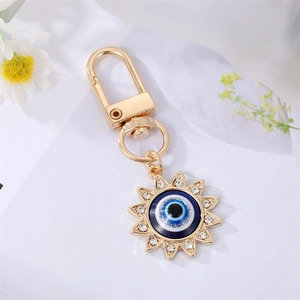 Golden sun evil eye keychain with sparkling rhinestones for handbags and purses