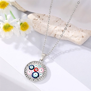 Silver evil eye pendant necklace with colorful enamel charms and shimmering rhinestones