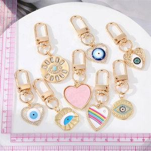 Detailed collection of gold alloy Evil Eye and heart pendants with lobster clasps