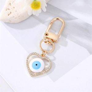 Detail of gold heart Evil Eye keychain with sparkling rhinestones and lobster clasp