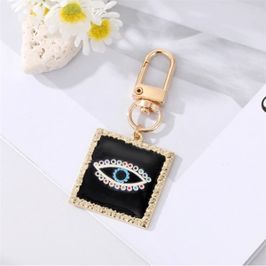 Detailed macro view of an Evil Eye heart charm with colorful crystals and gold plating