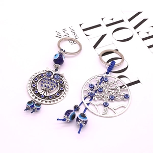 Détails des porte-clés hibou et arbre de vie avec perles en résine bleue