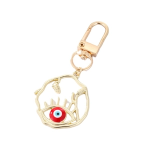 Porte-clés œil maléfique doré avec motif feuille évidée et pendentif huile bleue