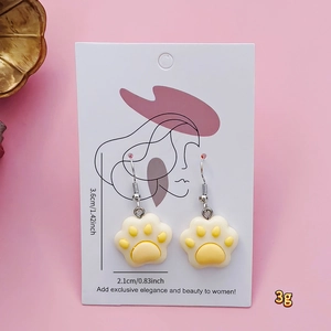 Detail view of cute cat paw earrings with dimensions 2.1x3.6cm and lightweight 3g resin design