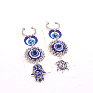 Bohemian silver evil eye keychain set with Hamsa hand and turtle charms in blue resin