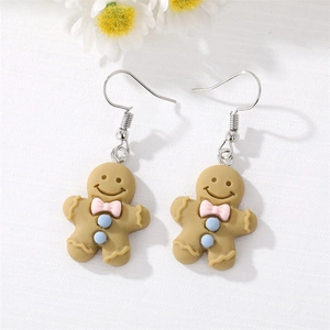Boucles d'oreilles pendantes en résine bonhomme de pain d'épices avec nœud rose