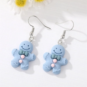 Boucles d'oreilles bonhomme pain d'épice en résine bleu clair avec nœud vert mignon