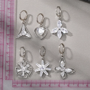 Detailed size comparison of six sparkling silver earrings with zircons and various shapes