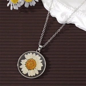 Silver chain necklace with a round dried white daisy flower glass pendant