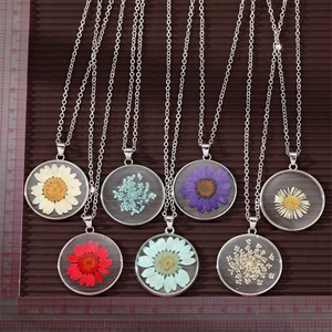 Detail view of 2.8cm dried flower necklace pendant with scale ruler measurement