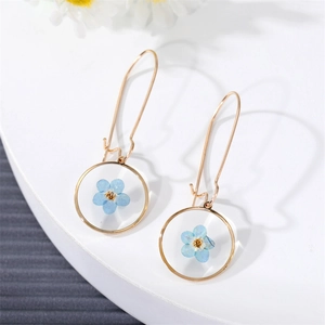 Handmade resin round hoop earrings with blue dried flowers and gold hooks for women
