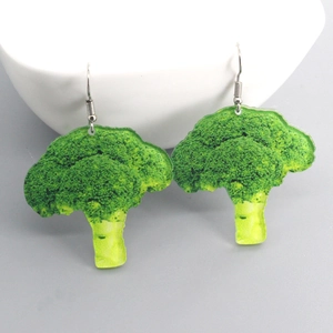 Minimalist broccoli earrings with 3D realistic texture and silver metal hooks on white bowl