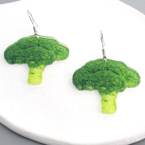 Creative broccoli shape green acrylic earrings with silver hooks on marble tray