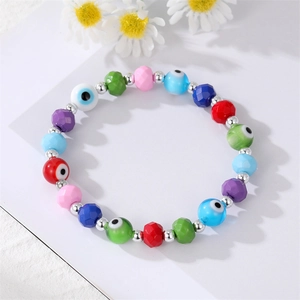 Bohemian colorful beaded evil eye bracelet with faceted resin charms on white background