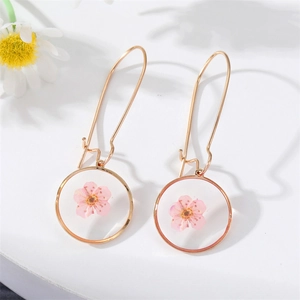 Elegant gold-tone circular drop earrings with real pink dried flowers in resin