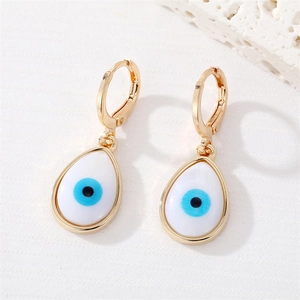 Golden hook earrings featuring evil eye teardrop pendants on a minimalist white background