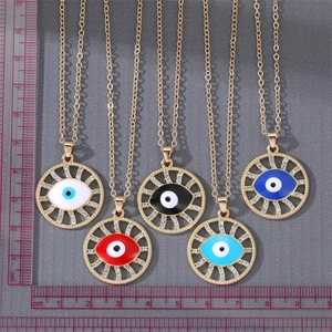 Detailed view of evil eye pendants in five colors with rhinestone halo and gold chain