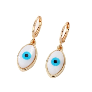 Golden evil eye hoop earrings with white enamel charms and blue pupil details