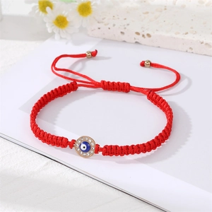 Handmade red braided Evil Eye bracelet with sparkling crystals and gold plating