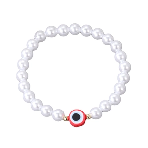 Fashionable freshwater pearl bracelet with red evil eye charm and golden beads